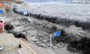 Tsunami-crashes-over-a-st-007.jpg