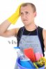 41499-tired-man-in-apron-with-cleaning-supplies.jpg