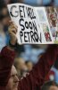 A-fan-holds-a-banner-of-suppor_54279421008_54115221160_261_396.jpg
