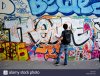 paris-france-street-scene-young-male-teen-street-graffer-painting-BFGC4T.jpg